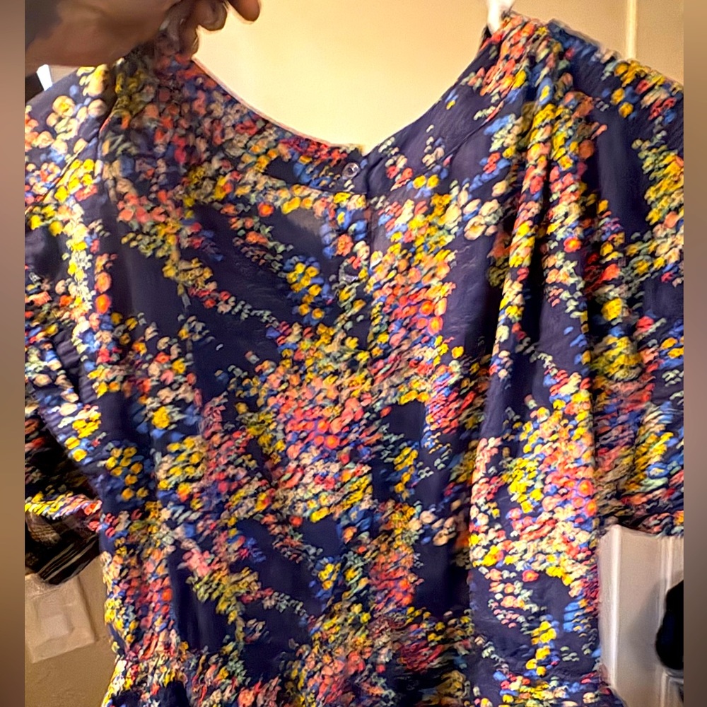 Flowers on a blue shirts blouse